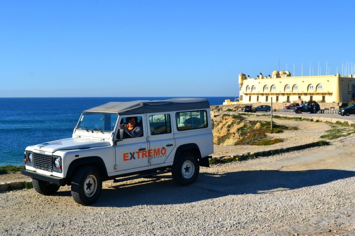 a group of people riding a jeep