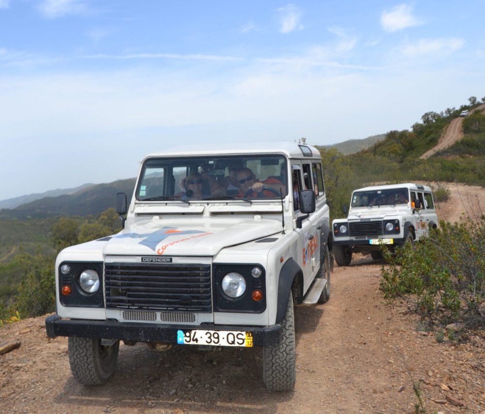 a group of people riding a jeep