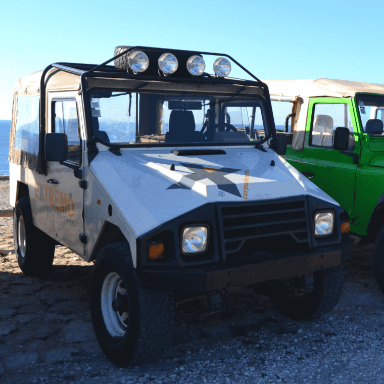 a truck parked next to a car