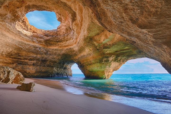 a body of water with a mountain in the background