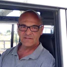 a man standing in front of a window