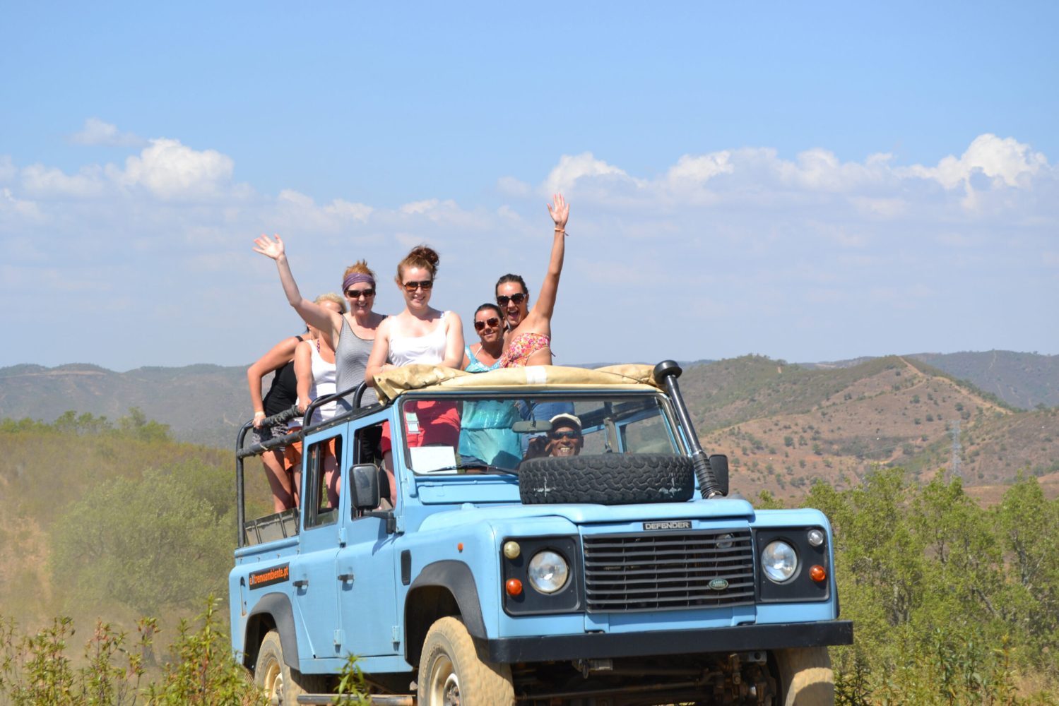 a group of people on a jeep