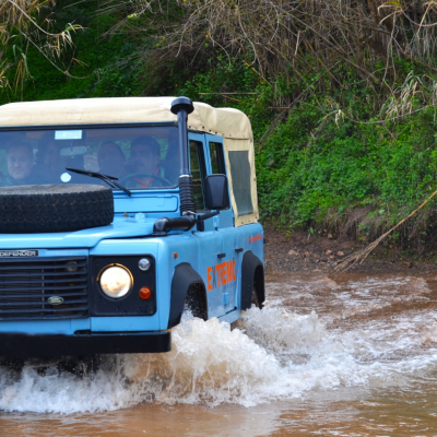a truck traveling down a river