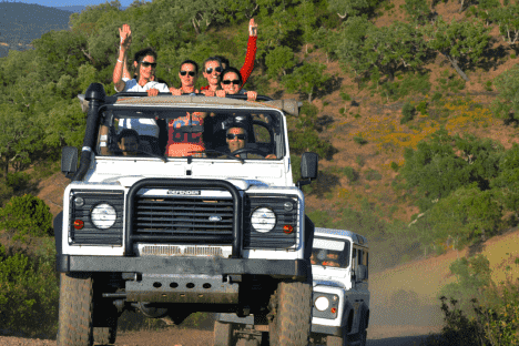 a group of people riding a jeep