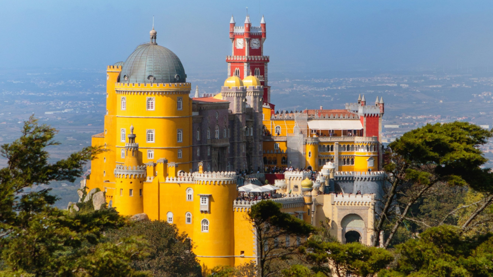 a castle with water in the background