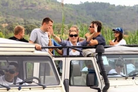 a group of people riding a jeep