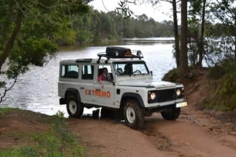 a truck driving down a dirt road