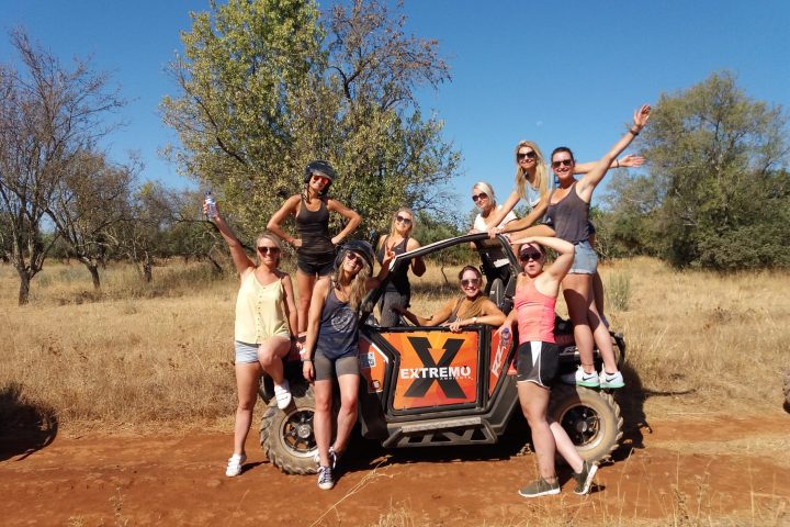 a group of people riding a buggy