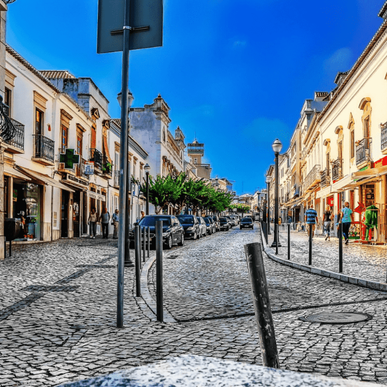 a group of people walking on a city street
