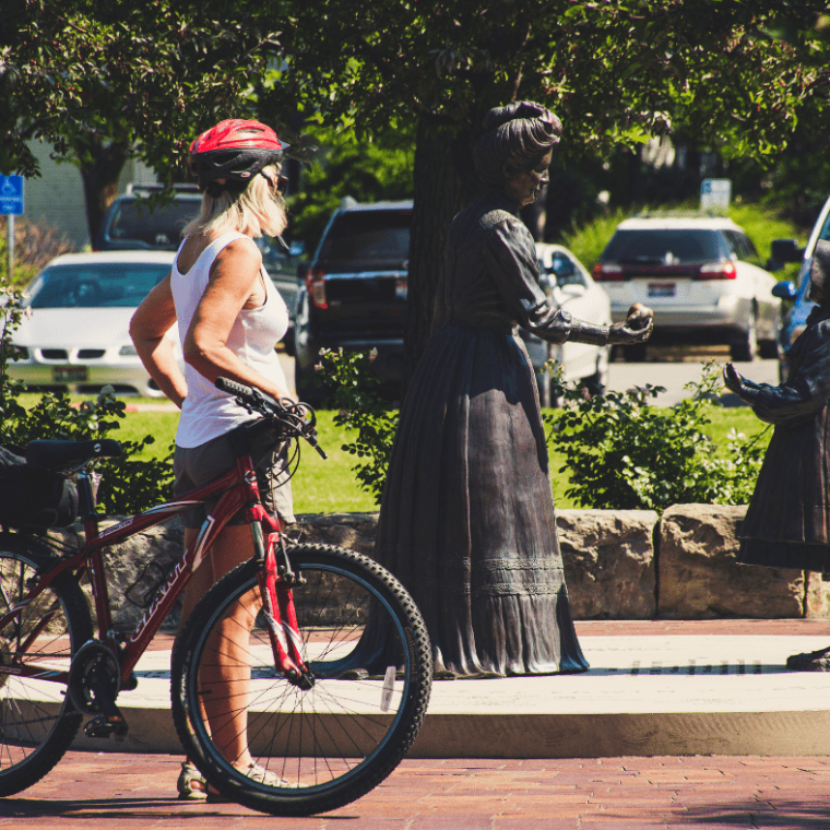 a person standing next to a bicycle