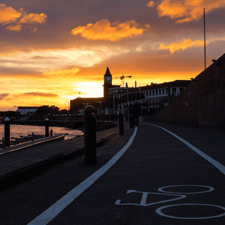 a sunset over a city street