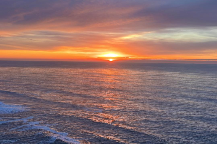a sunset over a body of water