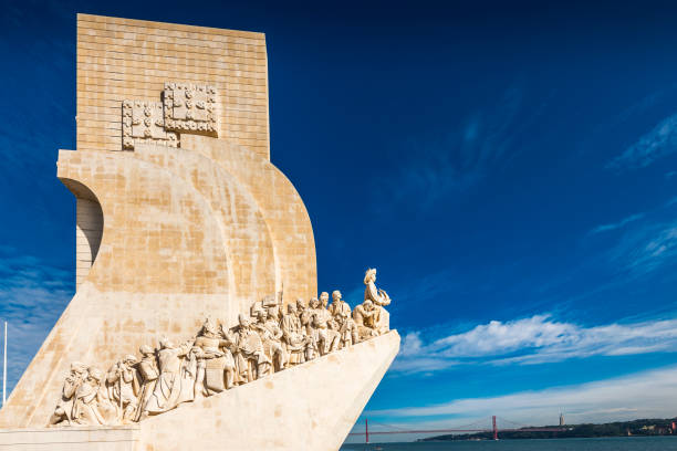 Monument of explorers on a stone ship with a clear blue sky backdrop.